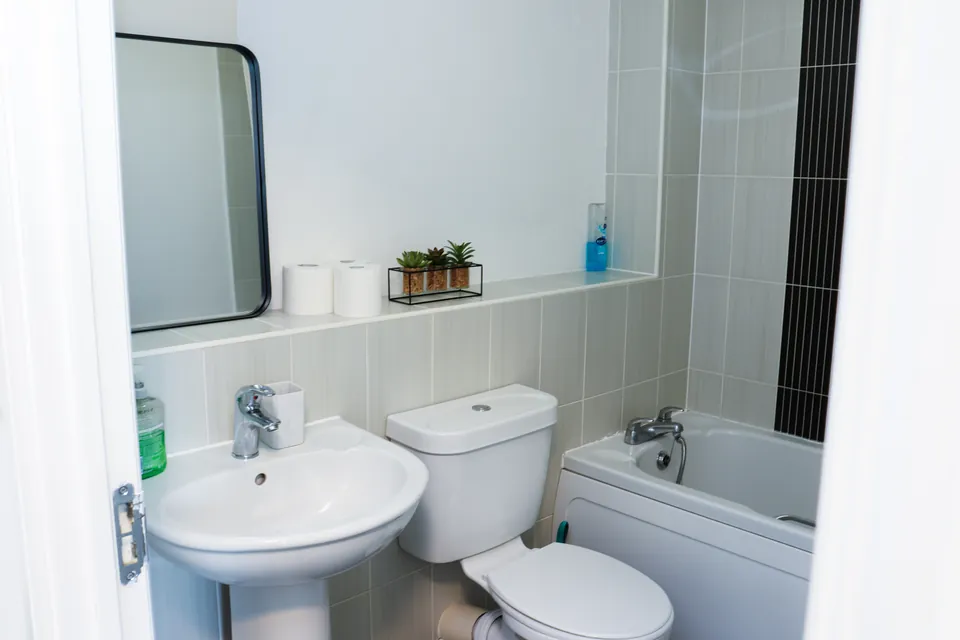 Bathroom at Humber Hub with a bath, basin and mirror
