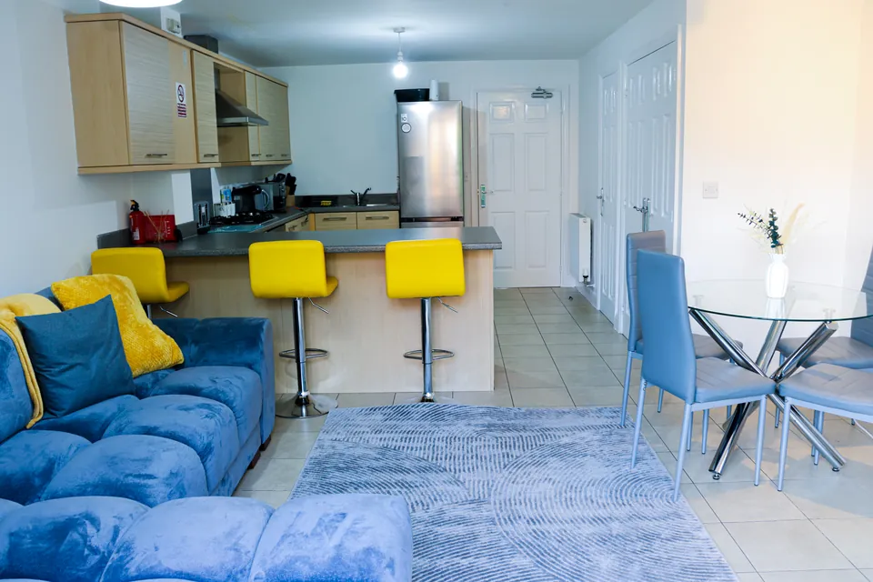 Velvet corner sofa and glass dining table at Humber Hub