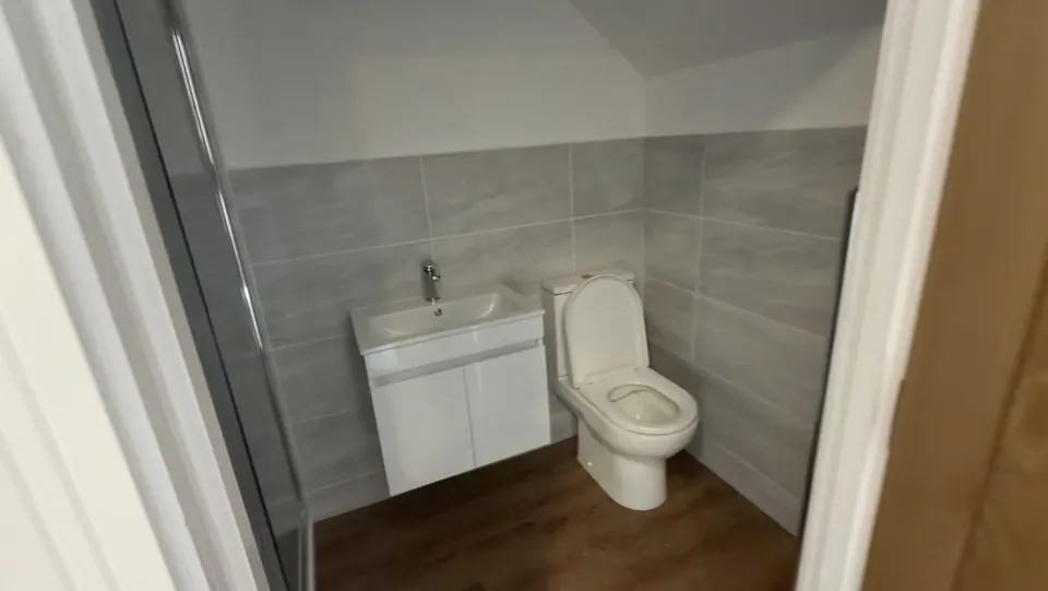 The top-floor bedroom's own shower room