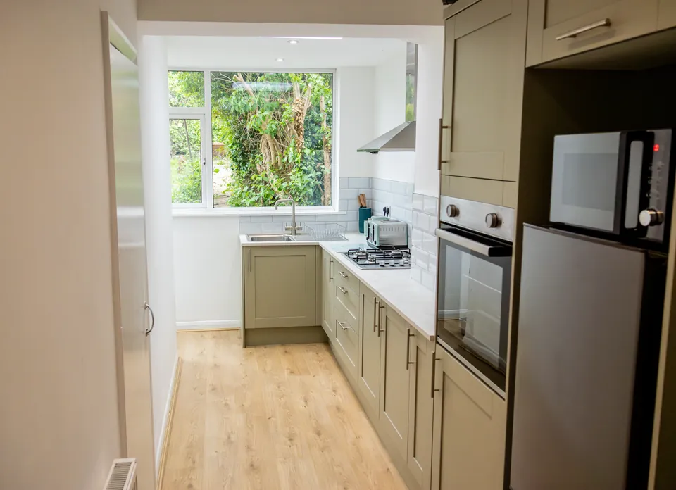 Kitchen at Sullivan Heights with an oven, hob and fridge-freezer